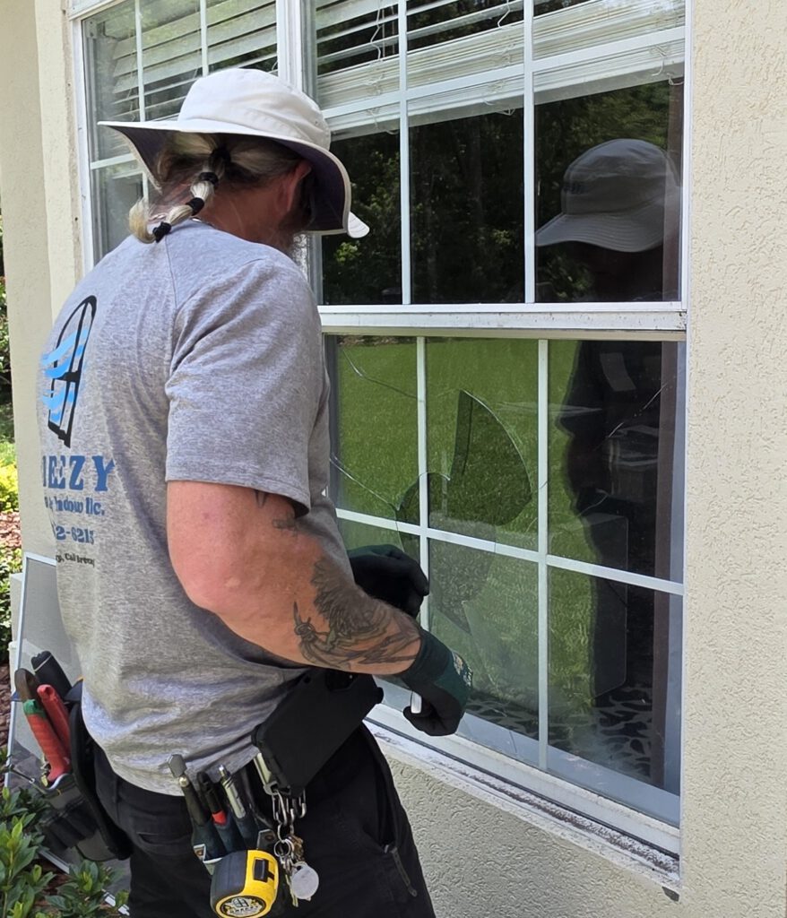Breezy technician repairing a cracked window pane