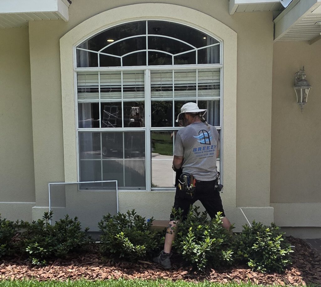 Owner Tyler Haikey of Breezy Glass and Window on the job